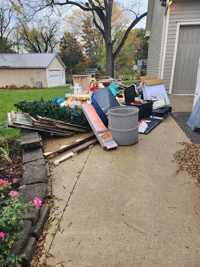Dumpster being loaded with debris for 10 Yard Dumpster Rental in Heber-Overgaard
